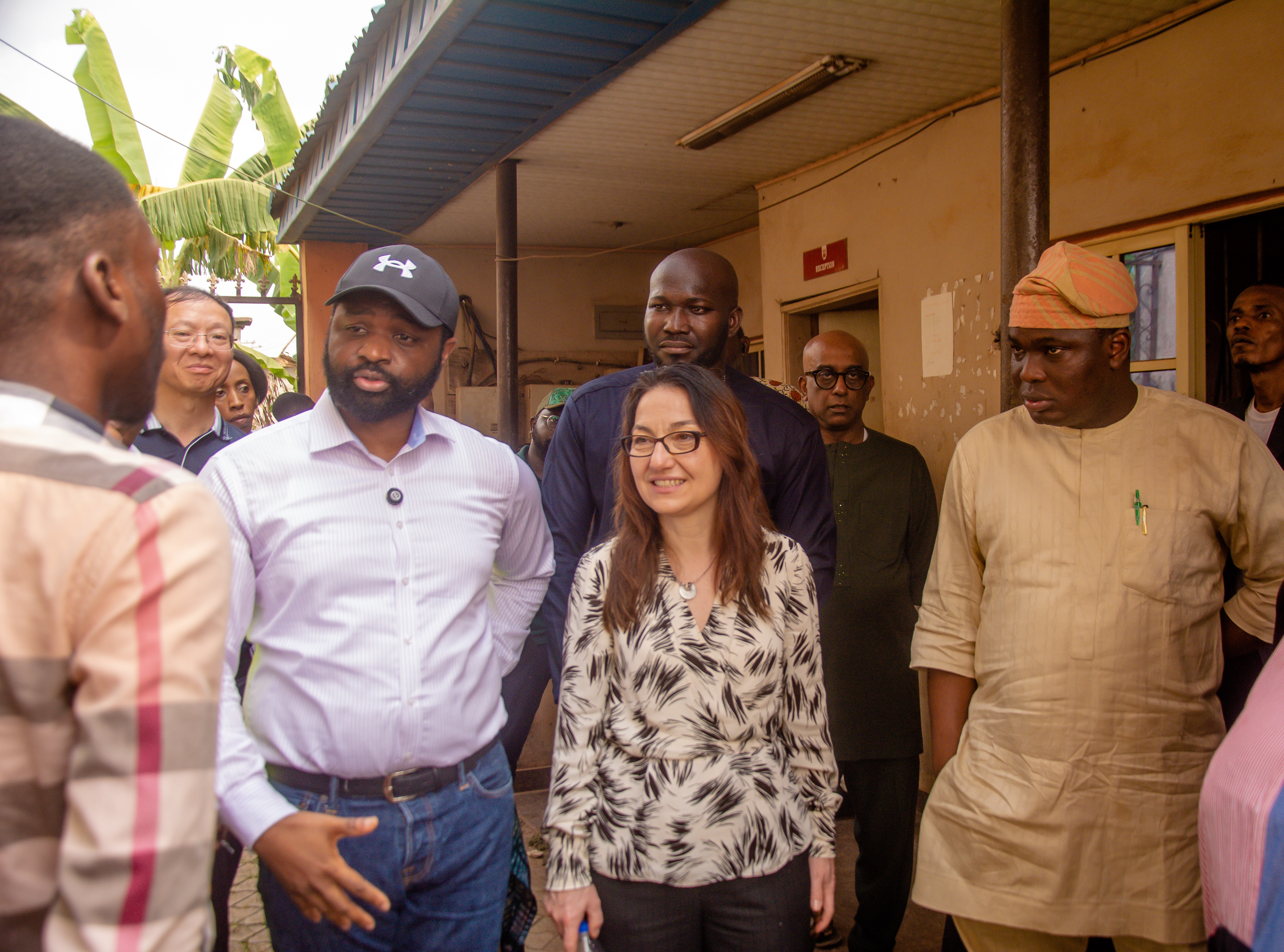 REA-NEP and World Bank Delegation engage one of the beneficiaries of 1MW interconnected solar mini-grid on the economic and social impact of the plant.