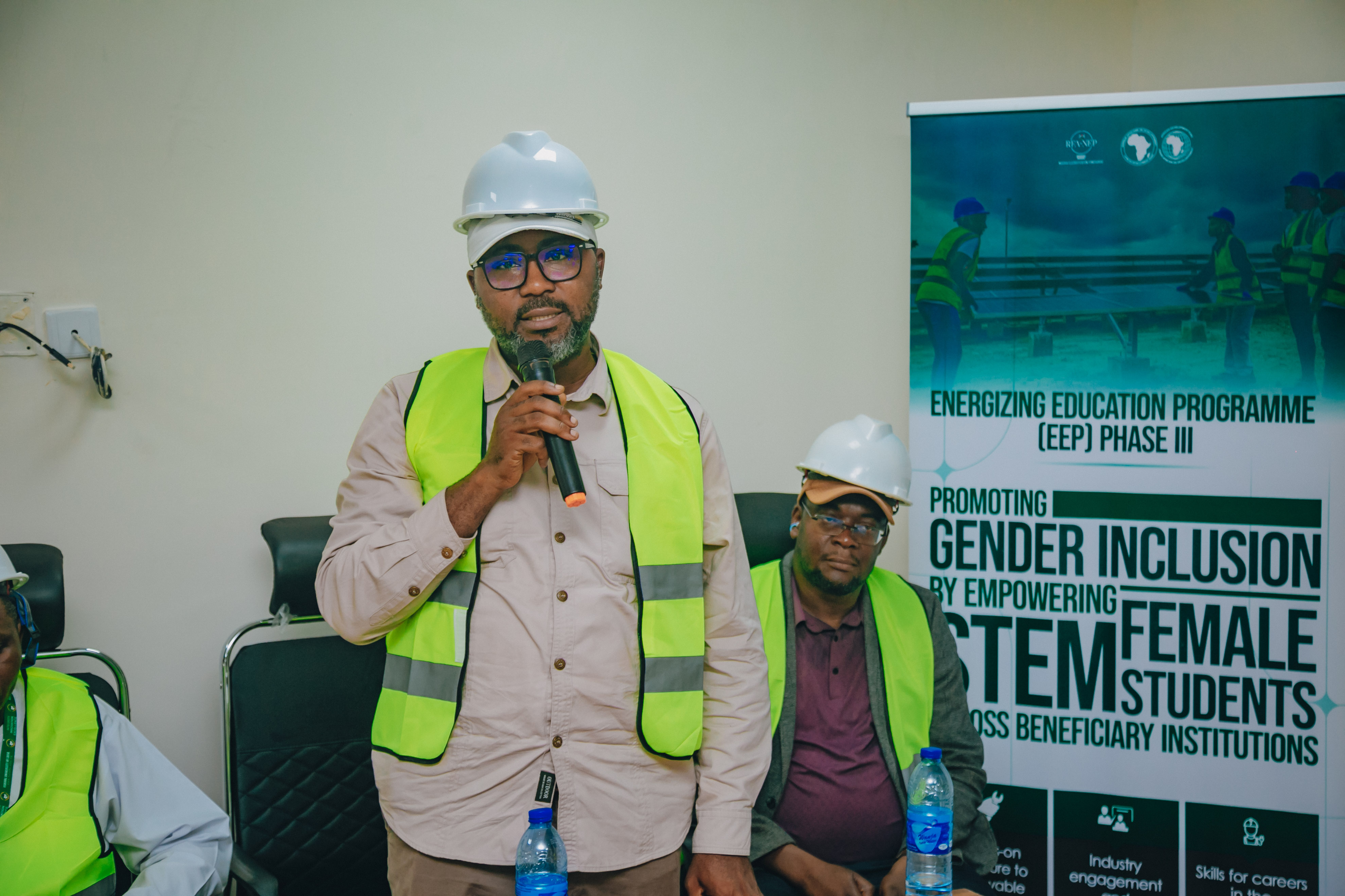 The AfDB Task team lead, Engr. Chigoziri Egeruoh addressing the female STEM students during an inspection to 1.6MW solar hybrid Mini grid deployed to FULAFIA under EEP phase III.